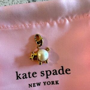 Rate Kate Spade pig clip on charm.